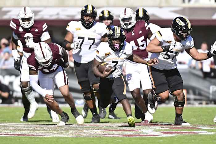Nov 18, 2023; Starkville, Mississippi, USA; Southern Miss Golden Eagles running back Frank Gore Jr. (3) runs the ball against the Mississippi State Bulldogs during the second quarter at Davis Wade Stadium at Scott Field. Mandatory Credit: Matt Bush-USA TODAY Sports  